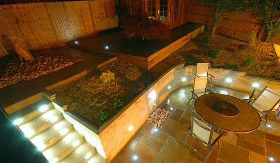 Contemporary garden at night with spot lights
