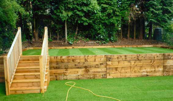 Levelled lawn with retaining wall in new railway sleepers, High Wycombe